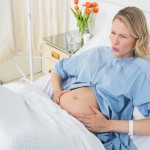 Expectant woman suffering from labor pains